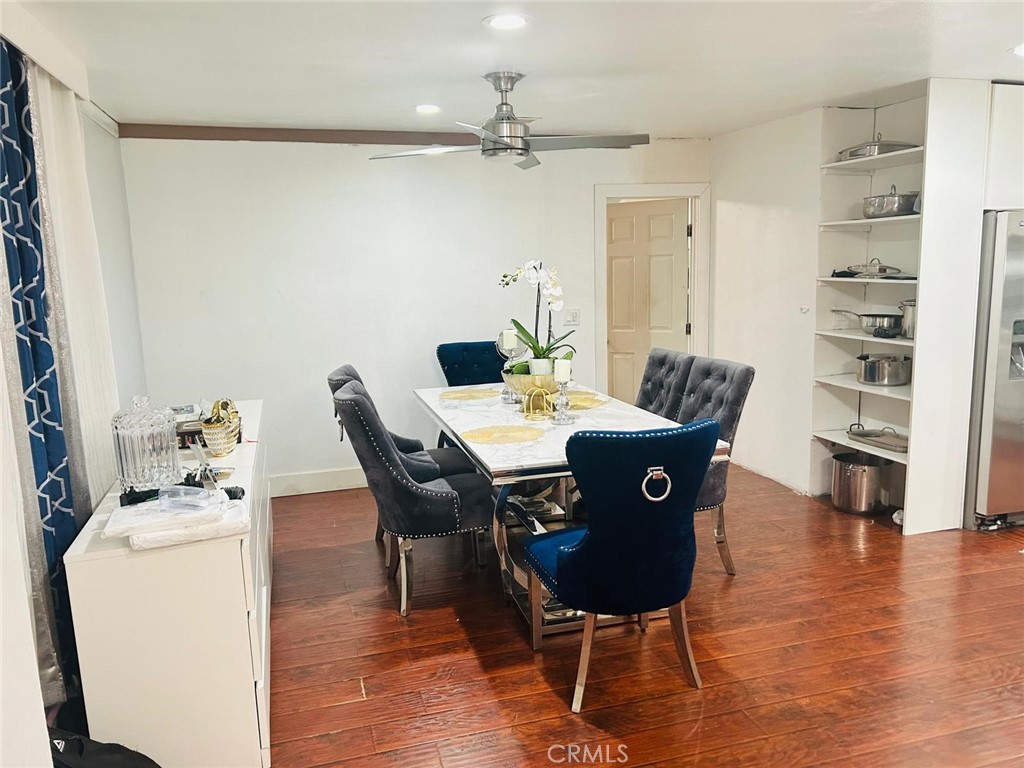 1025 South Riverside Avenue, Unit 26 Rialto, CA 92376 - Photo 12 of 20 a view of a dining room with furniture and wooden floor