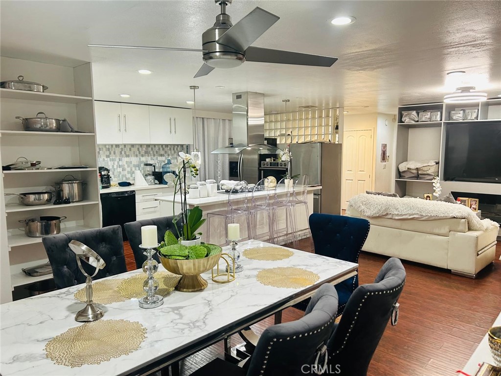 1025 South Riverside Avenue, Unit 26 Rialto, CA 92376 - Photo 14 of 20 a kitchen with a table chairs and kitchen view