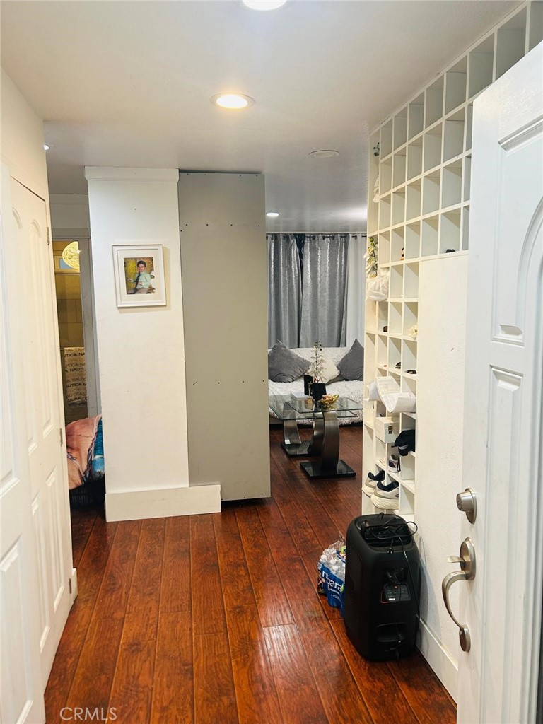 1025 South Riverside Avenue, Unit 26 Rialto, CA 92376 - Photo 18 of 20 a living room with furniture and a wooden floor