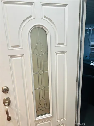 a close view of a utility room with dryer and washer