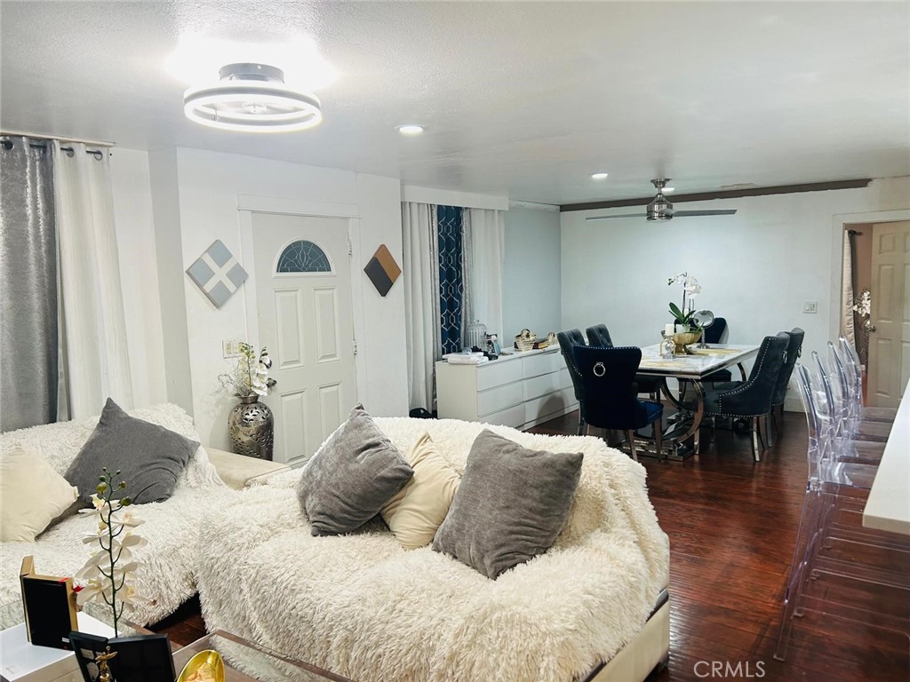 1025 South Riverside Avenue, Unit 26 Rialto, CA 92376 - Photo 5 of 20 a living room with furniture and wooden floor