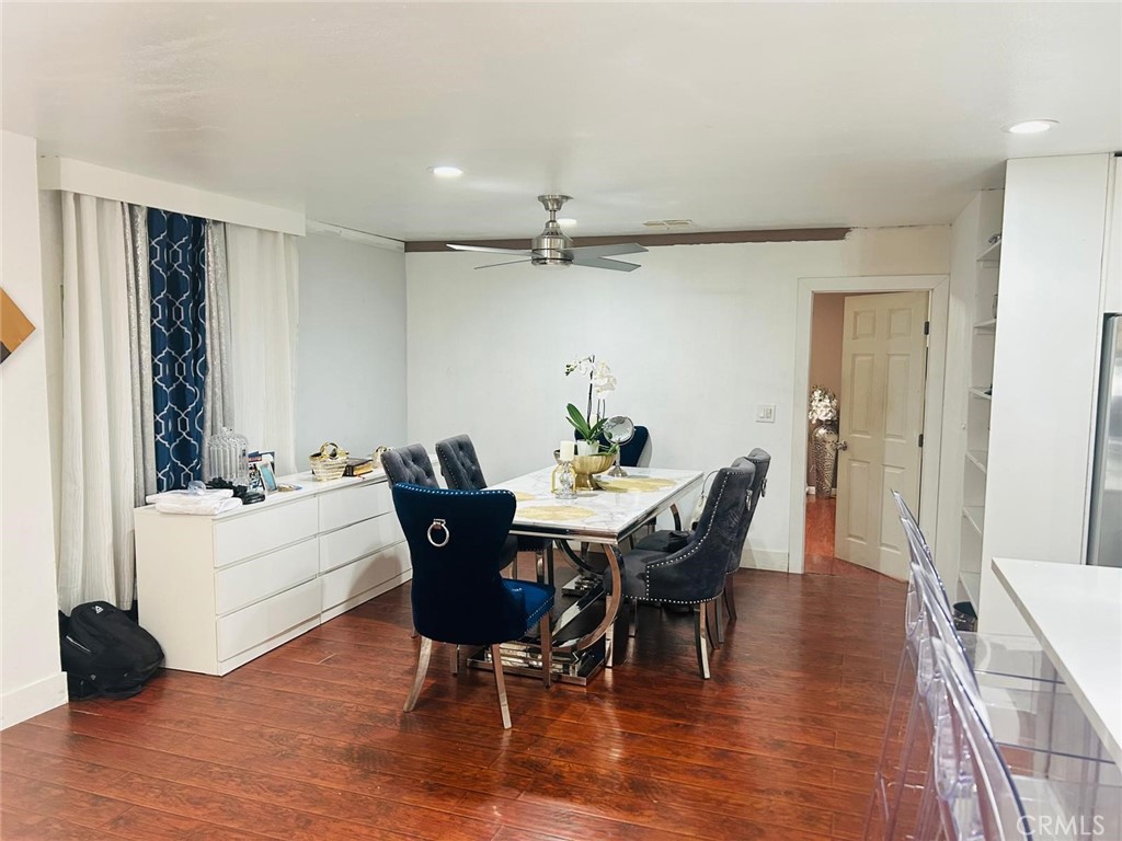1025 South Riverside Avenue, Unit 26 Rialto, CA 92376 - Photo 9 of 20 a view of a dining room with furniture and wooden floor