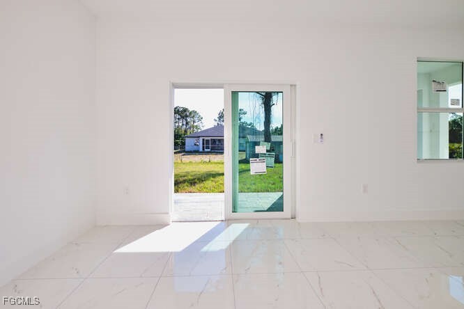 3421 55th Street West Lehigh Acres, FL 33971 - Photo 11 of 38 a view of an empty room with a window