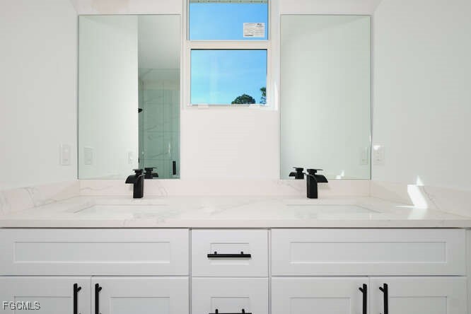 3421 55th Street West Lehigh Acres, FL 33971 - Photo 20 of 38 a bathroom with a bathtub and a sink