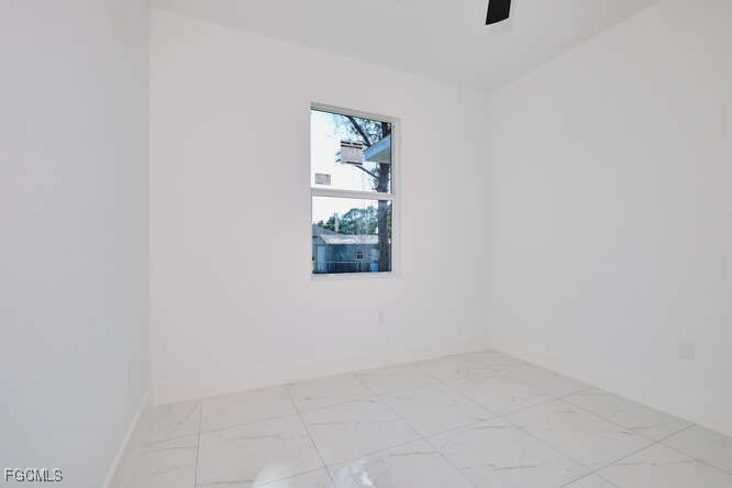 3421 55th Street West Lehigh Acres, FL 33971 - Photo 24 of 38 an empty room with a window