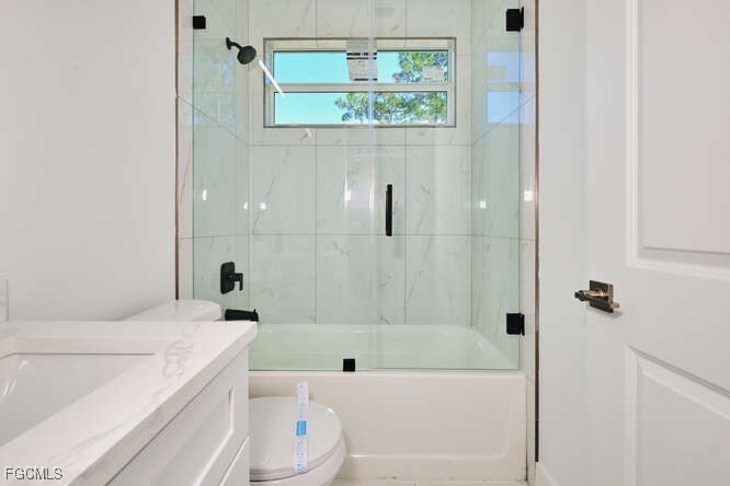 3421 55th Street West Lehigh Acres, FL 33971 - Photo 25 of 38 a bathroom with a sink a toilet and bathtub