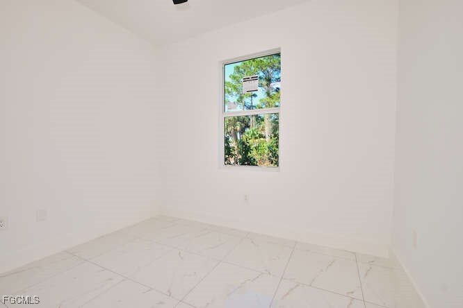 3421 55th Street West Lehigh Acres, FL 33971 - Photo 29 of 38 a view of an empty room with a window