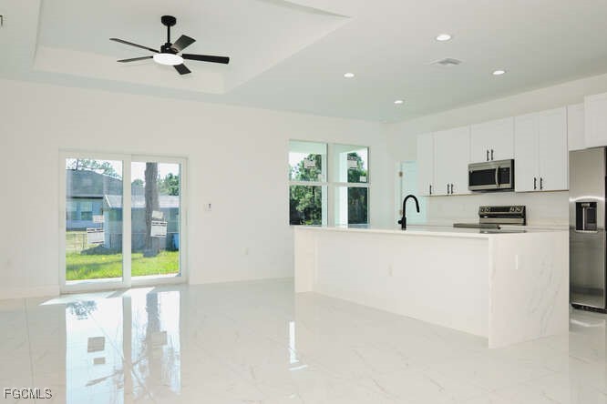 3421 55th Street West Lehigh Acres, FL 33971 - Photo 4 of 38 a view of kitchen with microwave and window