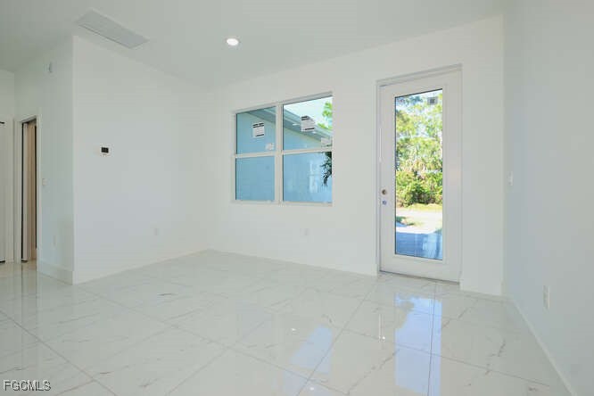 3421 55th Street West Lehigh Acres, FL 33971 - Photo 10 of 38 an empty room with windows