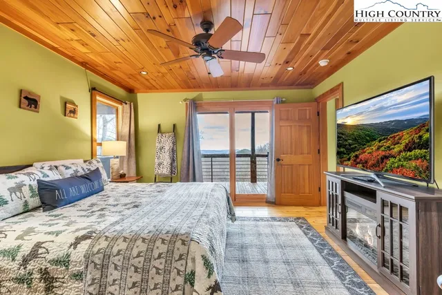 a spacious bedroom with a large bed and a large window