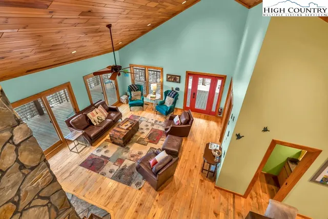 a bedroom with two beds and a large window