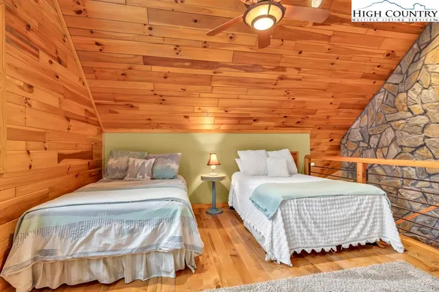 a balcony with table and chairs