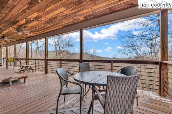 a view of outdoor space with wooden floor and windows
