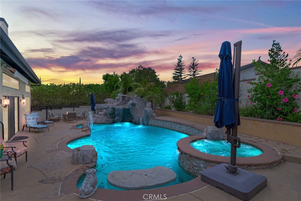 2429 Cliff Road Upland, CA 91784 - Photo 39 of 53 Fabulous rock water fall pool and grotto with built in table and umbrella areas. There is also a great Palapa