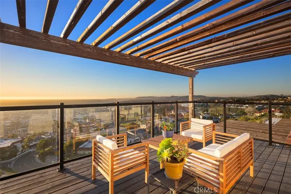 a balcony with furniture and city view