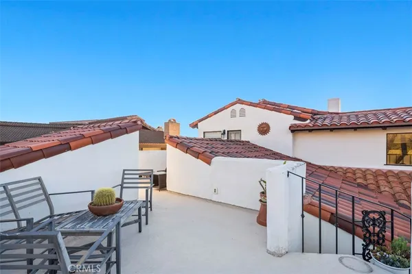 an outdoor view of a house with swimming pool