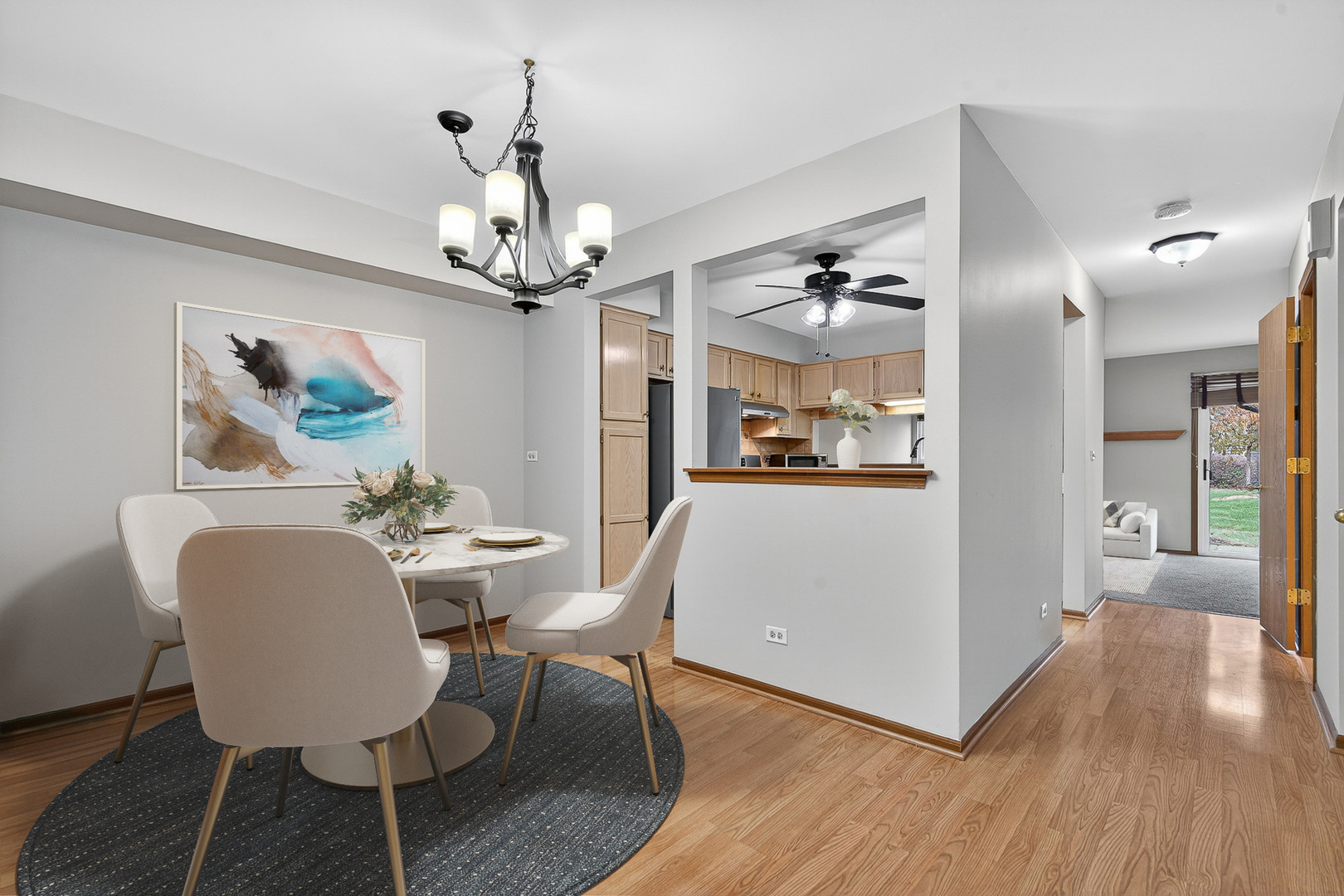 1176 Talbots Lane Elk Grove Village, IL 60007 - Photo 4 of 21 a view of a dining room with furniture wooden floor and chandelier