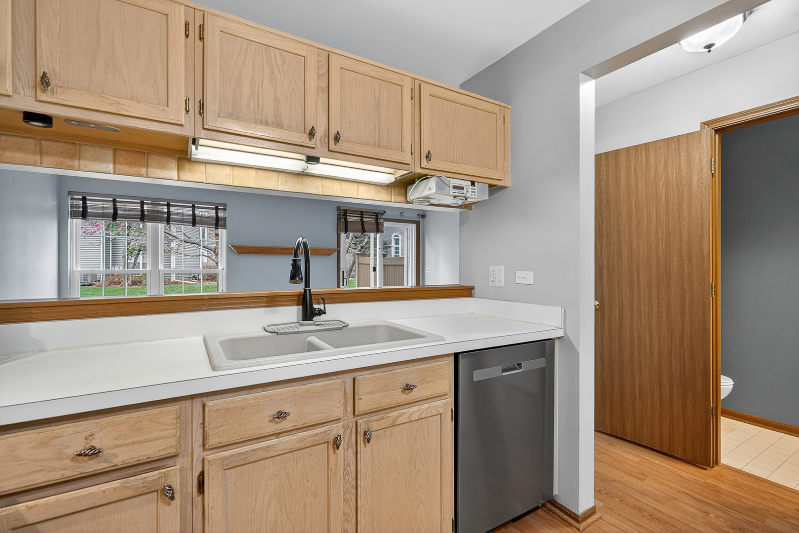 1176 Talbots Lane Elk Grove Village, IL 60007 - Photo 7 of 21 a kitchen with a sink and cabinets