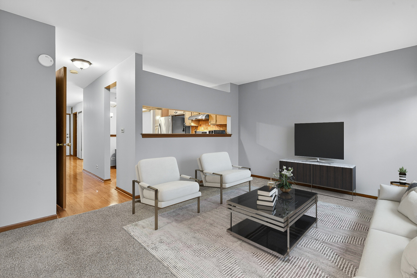 1176 Talbots Lane Elk Grove Village, IL 60007 - Photo 9 of 21 a living room with furniture a rug and a flat screen tv