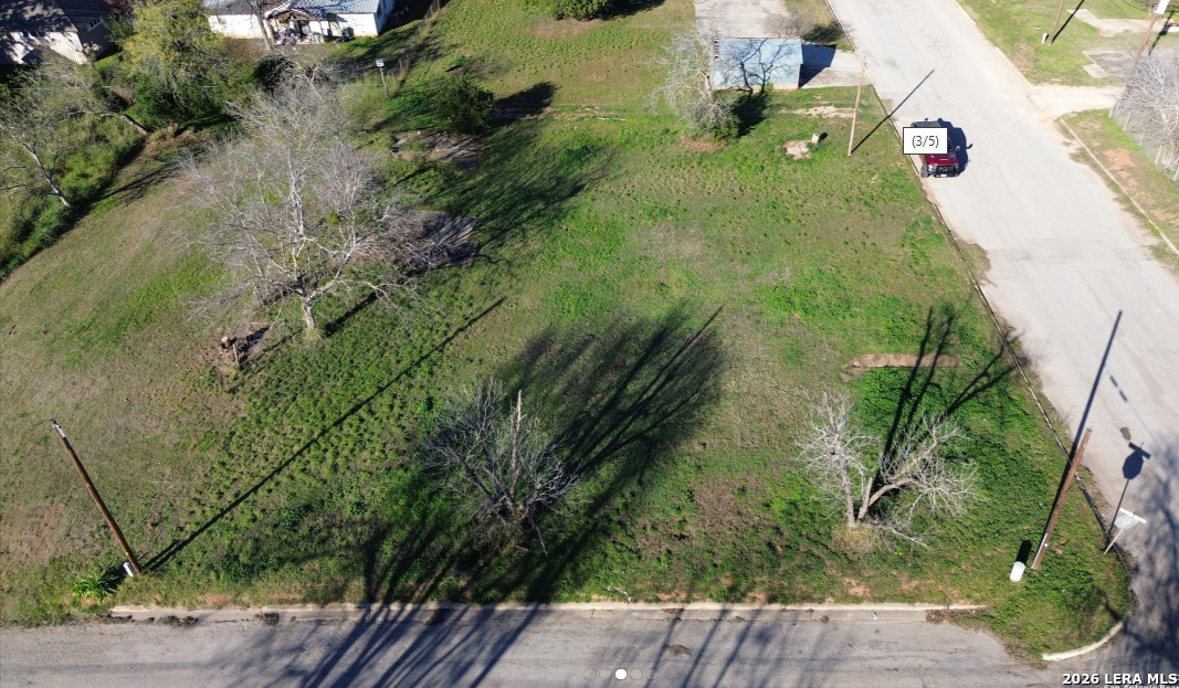 307 North Pecan Street Pearsall, TX 78061 - Photo 2 of 2 an aerial view of a house with a yard