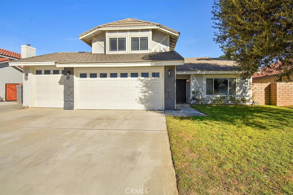3967 Merced River Road Ontario, CA 91761 - Photo 1 of 1 a front view of a house with a yard