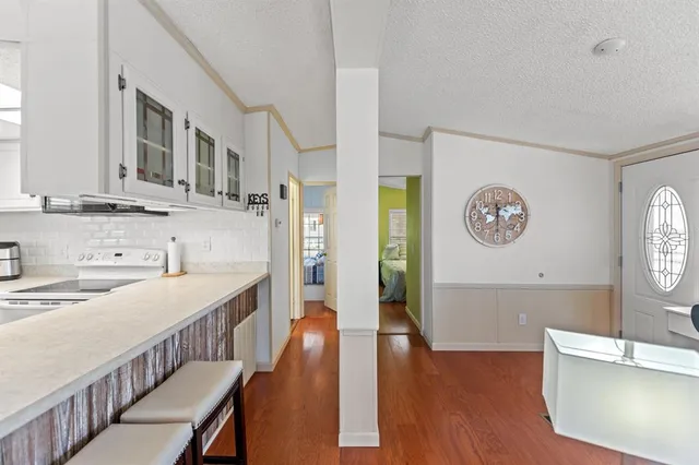 a view of a kitchen cabinets and wooden floor