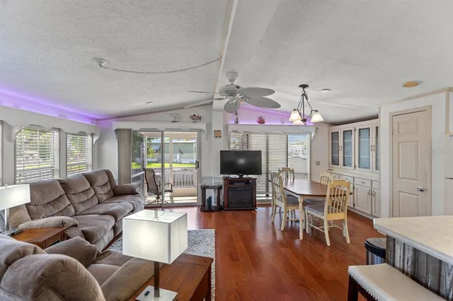 a living room with fireplace furniture and a flat screen tv