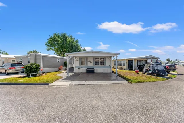 a view of house with outdoor space and swimming pool