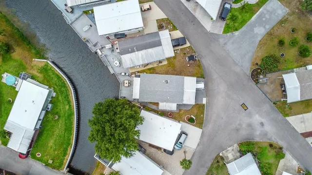 an aerial view of residential houses with outdoor space