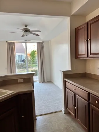 a kitchen with a refrigerator and a sink