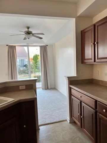 a kitchen with a refrigerator and a sink
