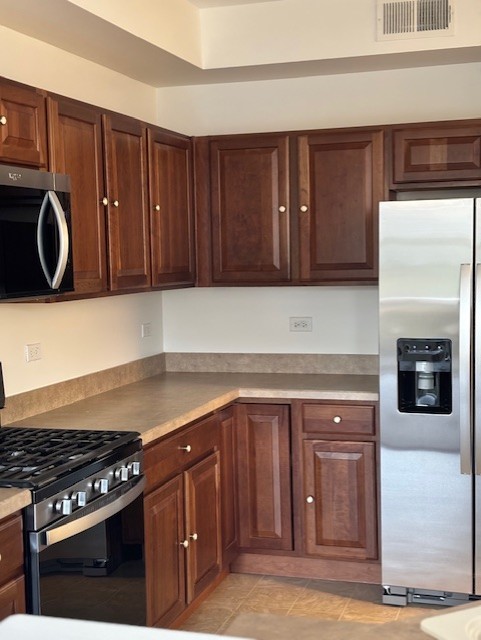 13455 Nealy Road Huntley, IL 60142 - Photo 13 of 22 a kitchen with granite countertop a stove and a cabinets
