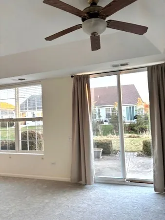 a view of an empty room with a balcony