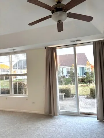 a view of an empty room with a balcony