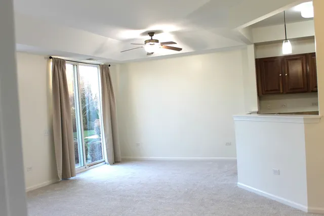 a view of a hallway with a chandelier