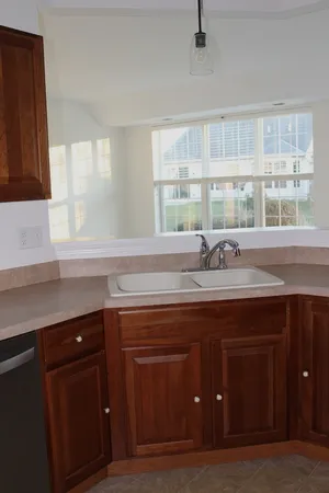 a kitchen with a sink and a window