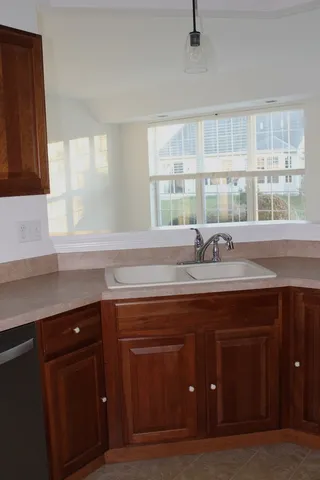a kitchen with a sink and a window