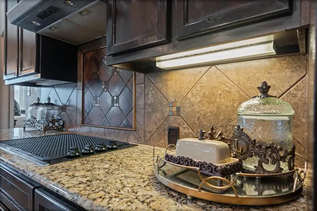 a kitchen with a stove and a sink