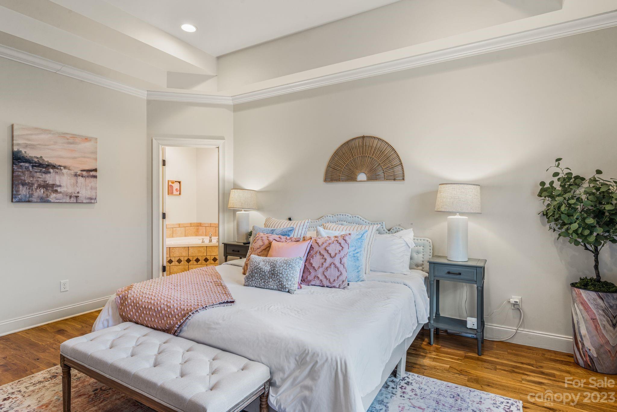 874 Burney Mountain Road Fletcher, NC 28732 - Photo 17 of 37 a bedroom with a bed and a potted plant