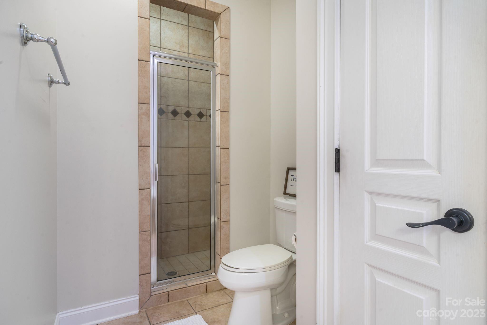 874 Burney Mountain Road Fletcher, NC 28732 - Photo 19 of 37 a bathroom with a toilet and a shower