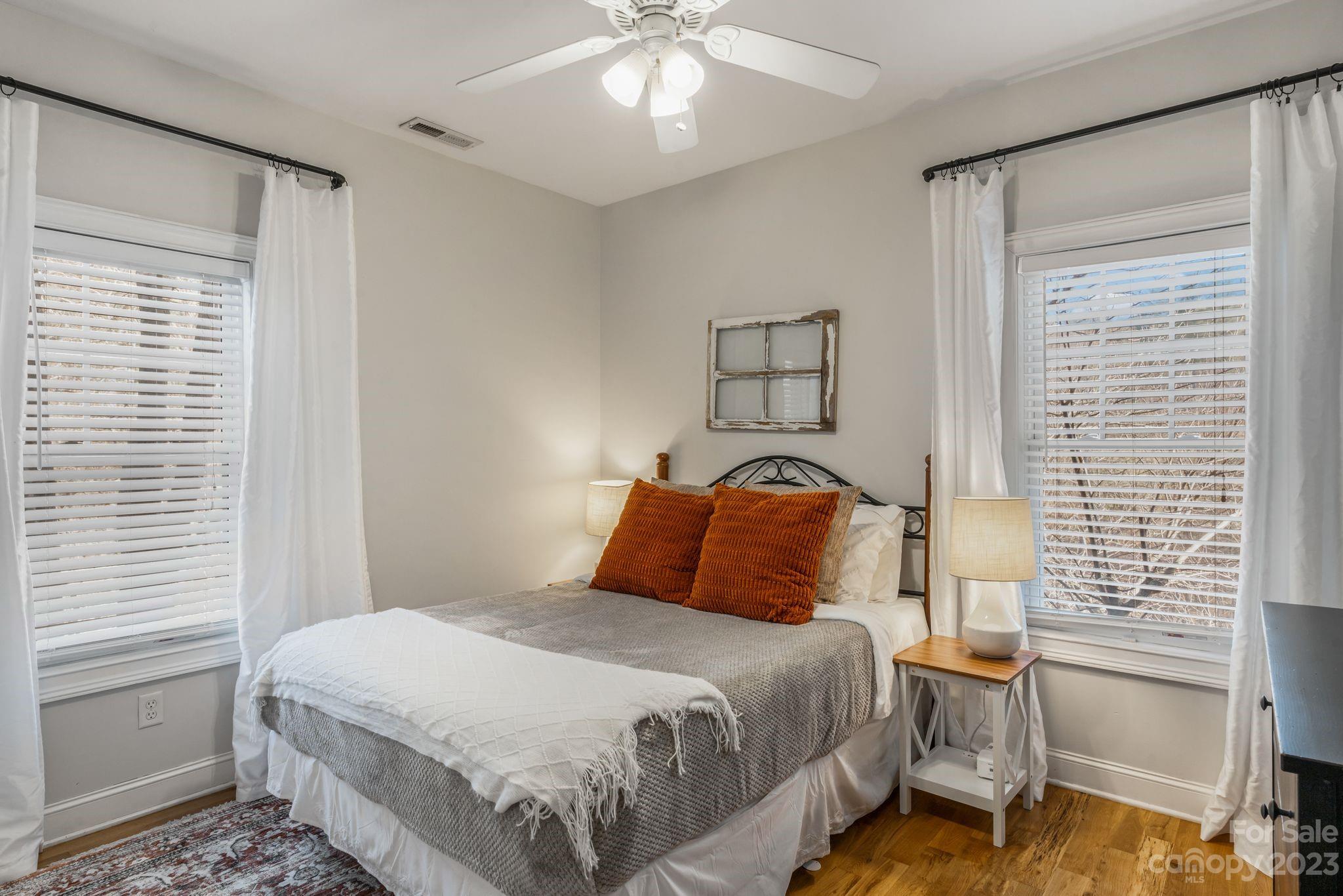 874 Burney Mountain Road Fletcher, NC 28732 - Photo 20 of 37 a bedroom with a bed and a window