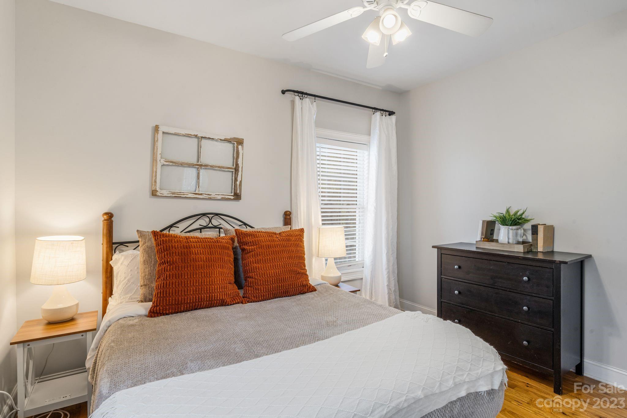 874 Burney Mountain Road Fletcher, NC 28732 - Photo 21 of 37 a bedroom with a bed and ceiling fan