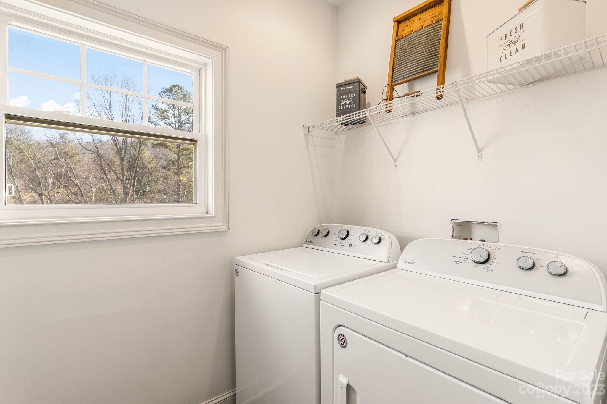 874 Burney Mountain Road Fletcher, NC 28732 - Photo 25 of 37 a view of washer and dryer with bathroom in the background
