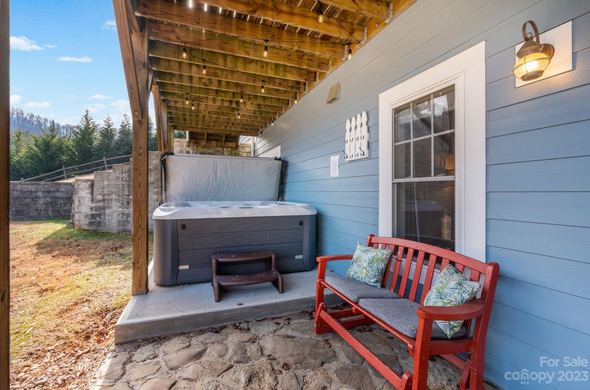 874 Burney Mountain Road Fletcher, NC 28732 - Photo 36 of 37 a outdoor living space with furniture and a fireplace