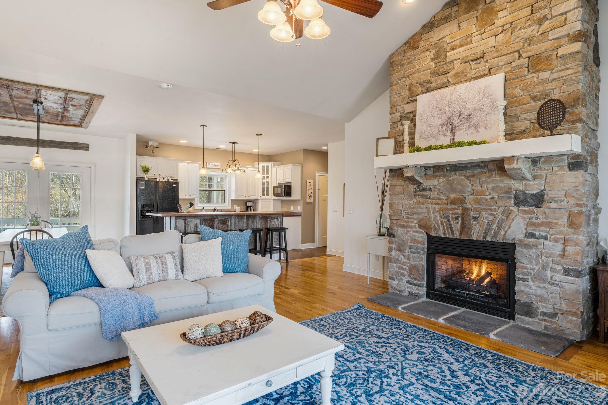 874 Burney Mountain Road Fletcher, NC 28732 - Photo 7 of 37 a living room with furniture and a fireplace