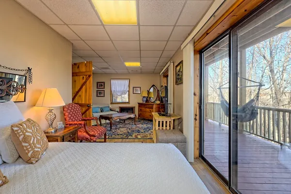 a living room with patio furniture and a window