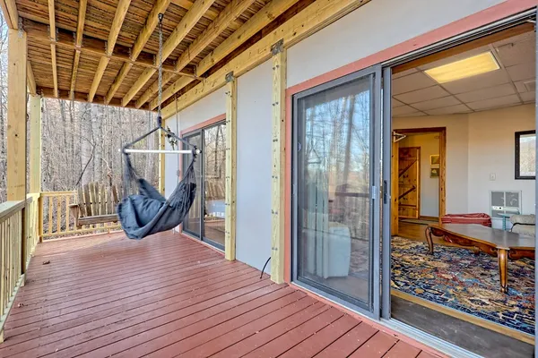 a view of a patio with a table and chairs