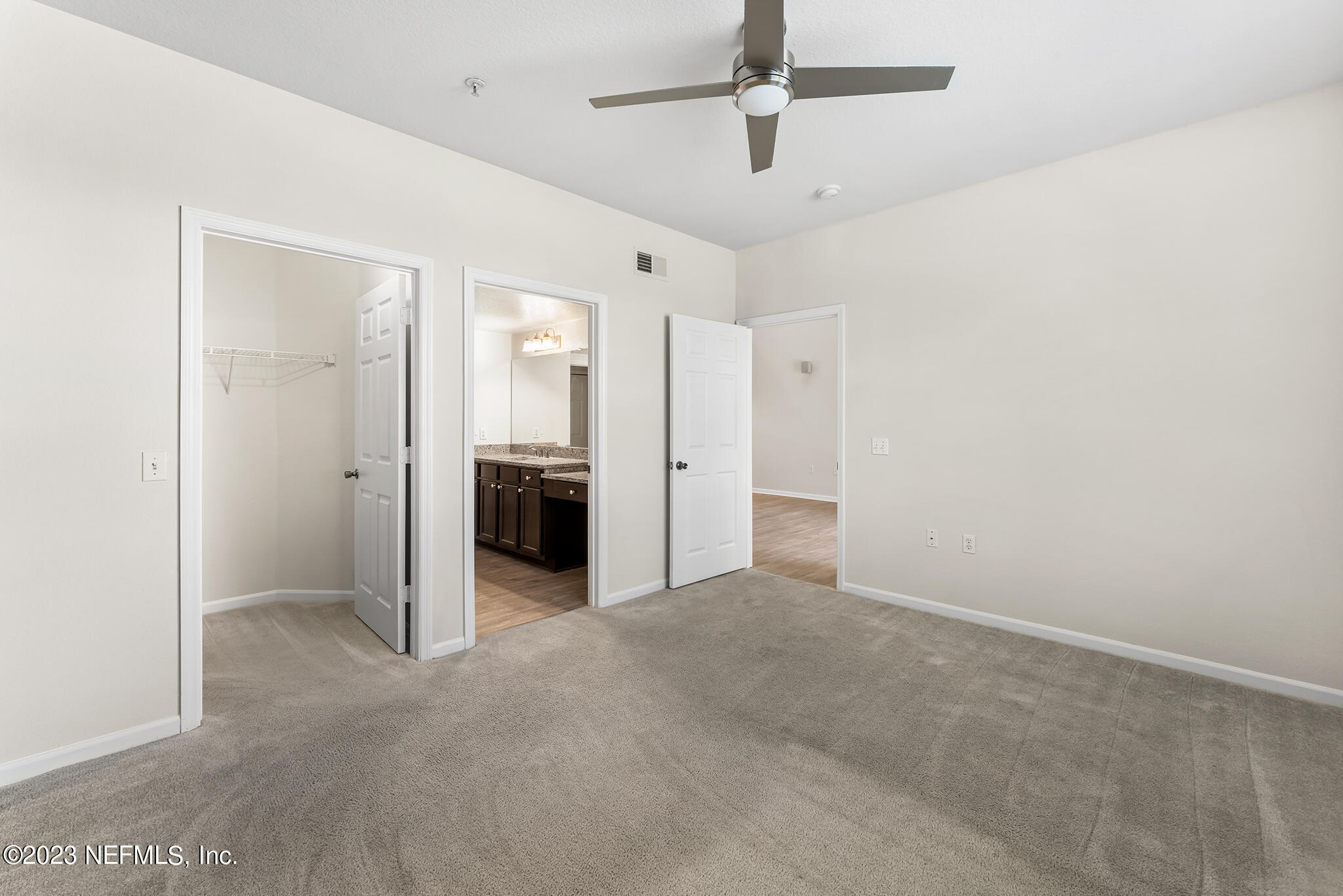 8550 Touchton Road, Unit 1136 Jacksonville, FL 32216 - Photo 15 of 53 en empty room with closet and a ceiling fan