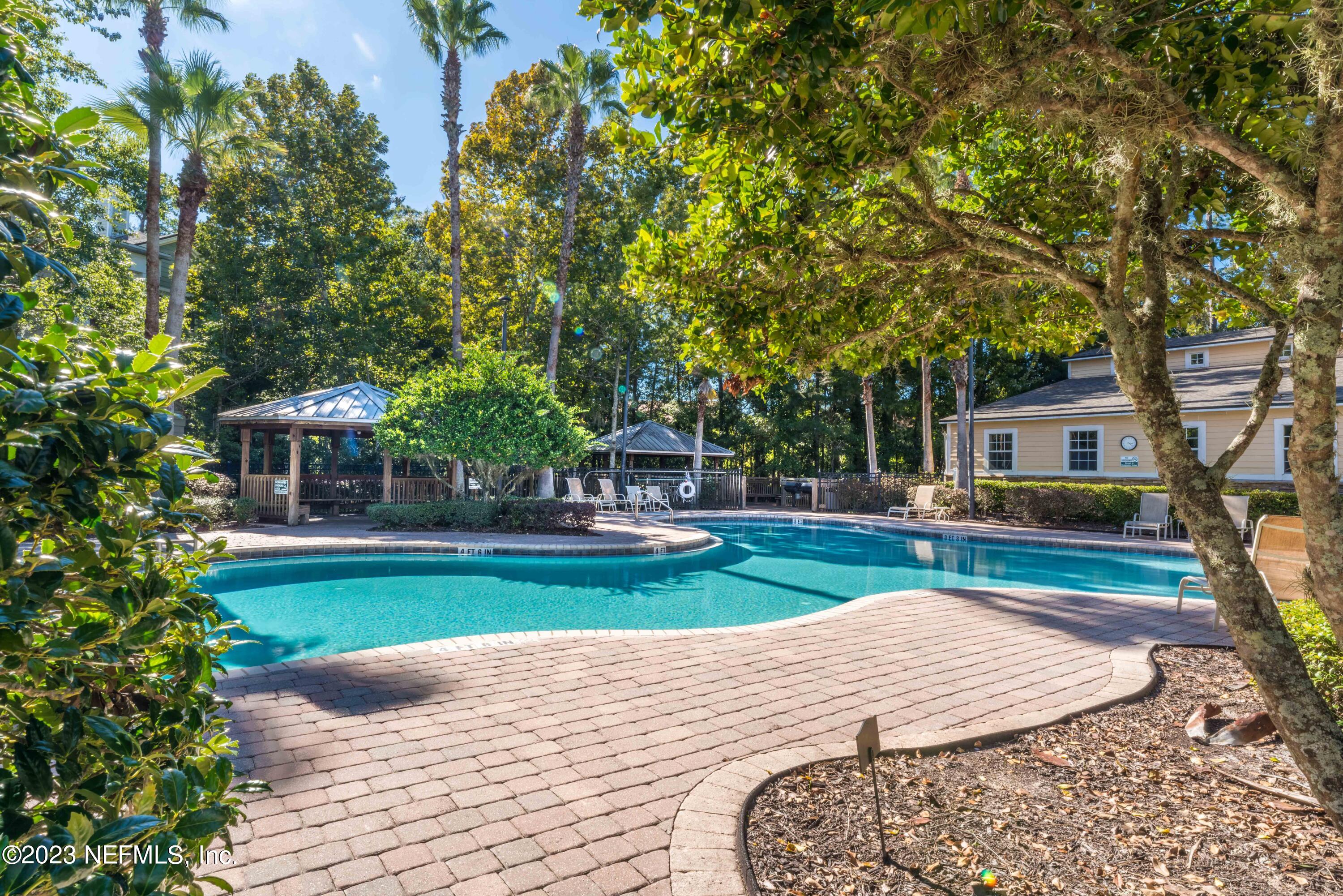 8550 Touchton Road, Unit 1136 Jacksonville, FL 32216 - Photo 29 of 53 a front view of a house with garden