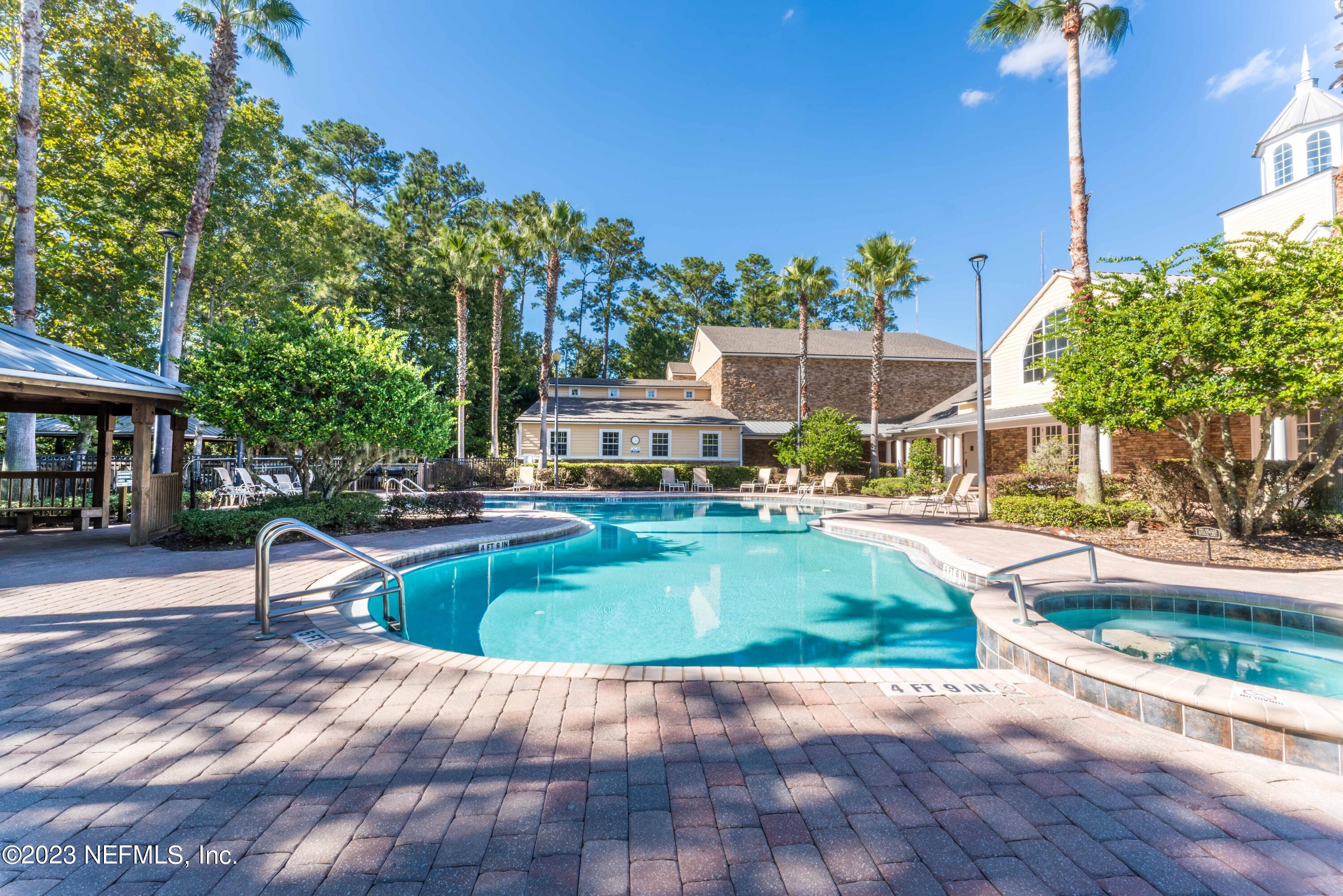 8550 Touchton Road, Unit 1136 Jacksonville, FL 32216 - Photo 32 of 53 a view of a swimming pool with a patio